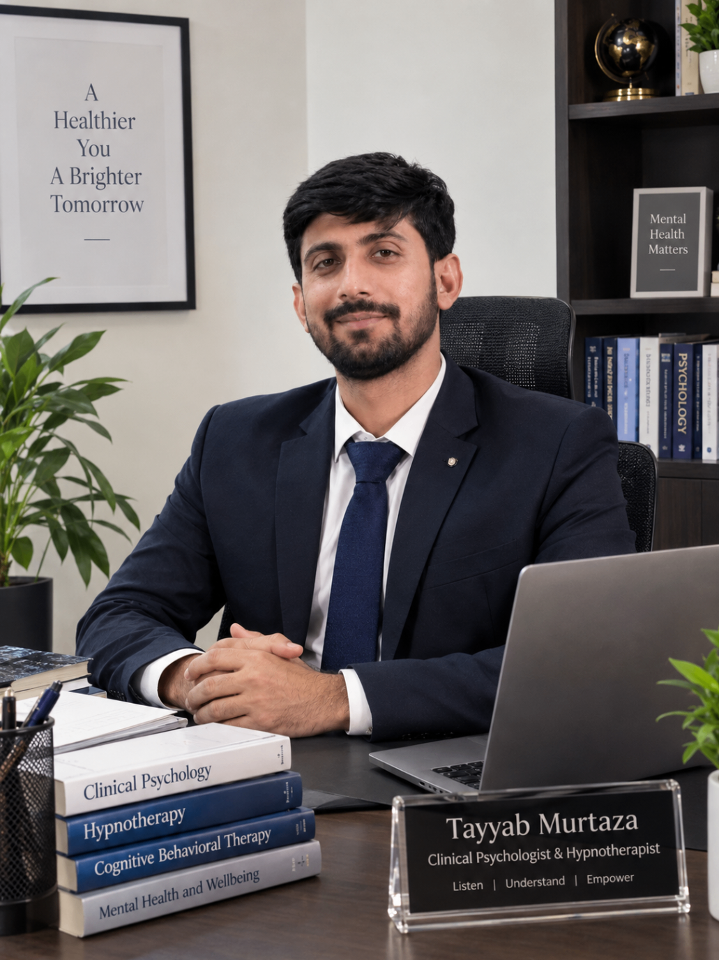 Tayyab Murtaza at his desk beside his professional nameplate